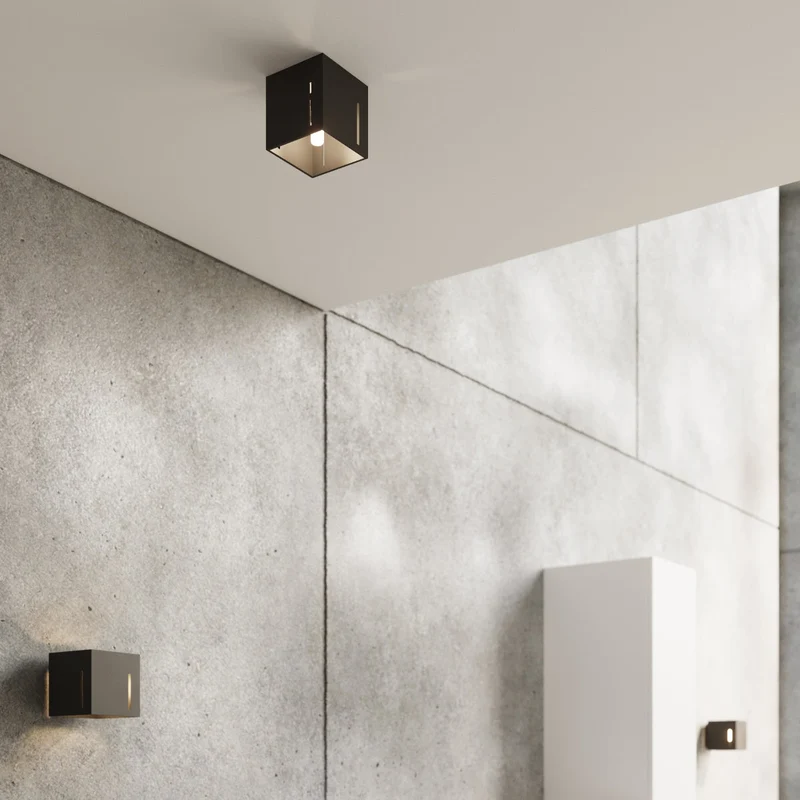 Moderne schwarze perforierte Wandleuchte – Noxarys