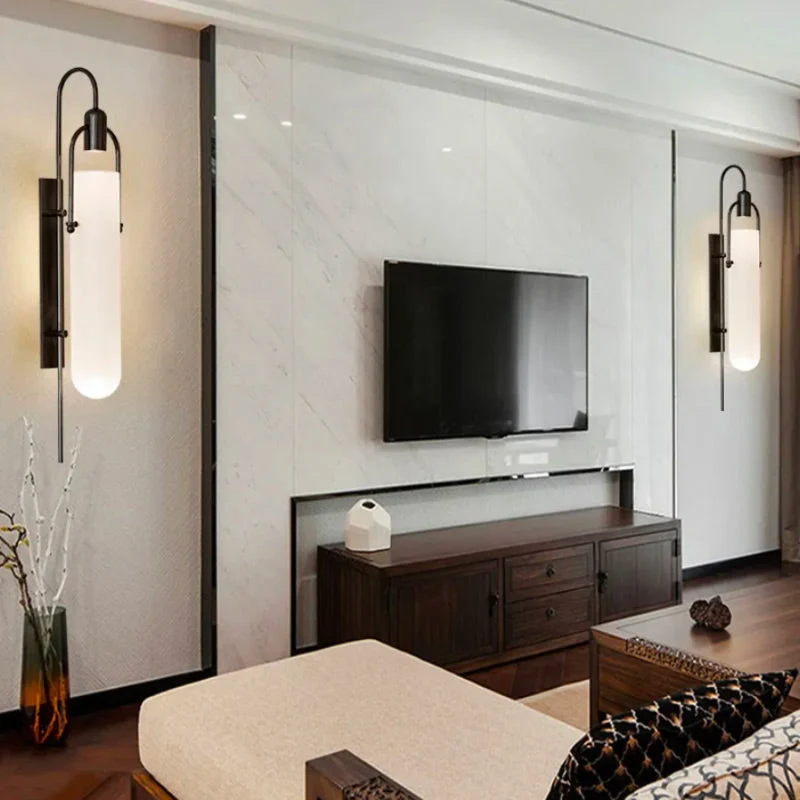 Moderne Wandleuchte in Gold und Schwarz – Estanor