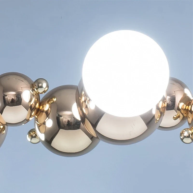 LED-Pendelleuchte aus goldenem Metall mit Blasenglas – Citrona