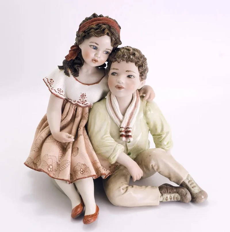 Casa Padrino Porzellan Deko Puppen Skulptur Junge & Mädchen H. 22,5 cm - Made in Italy