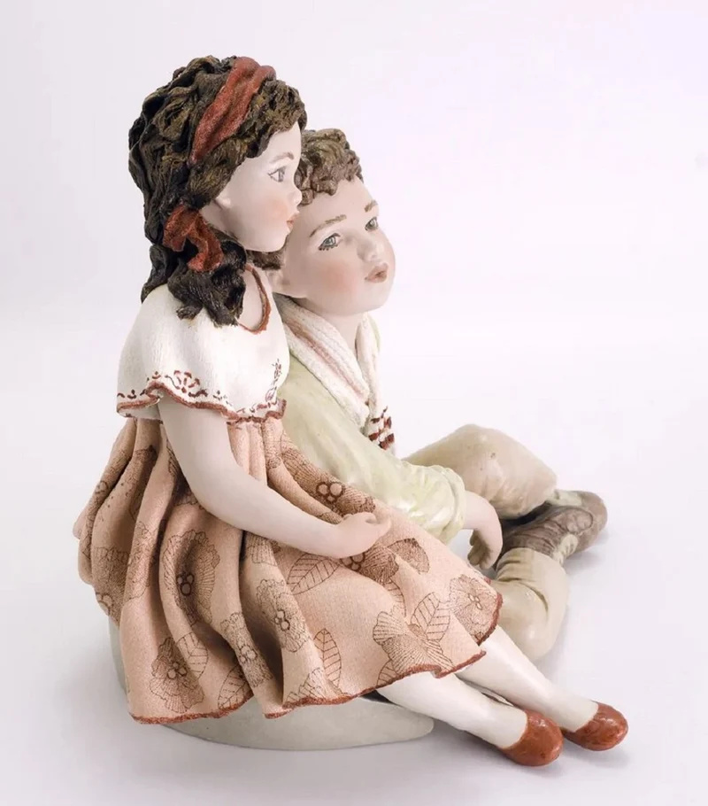 Casa Padrino Porzellan Deko Puppen Skulptur Junge & Mädchen H. 22,5 cm - Made in Italy