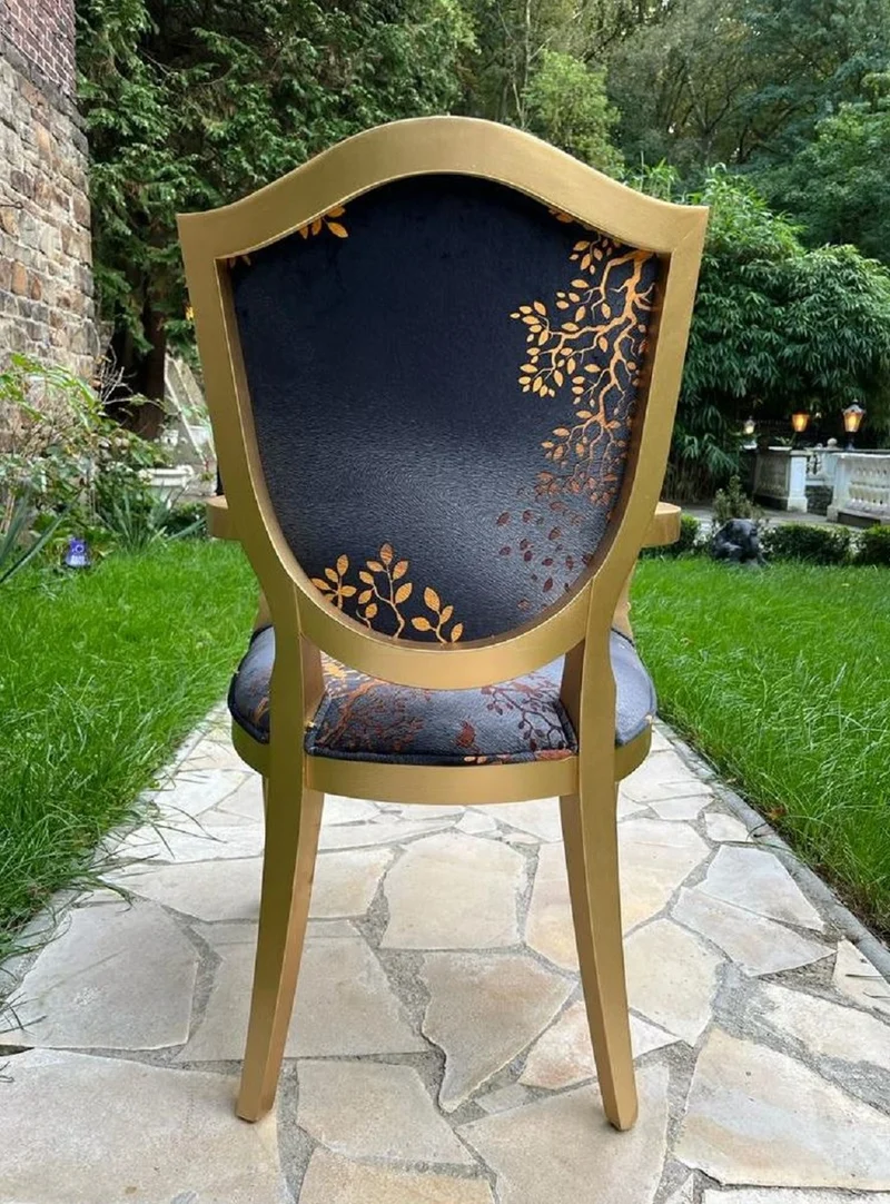 Casa Padrino Luxus Art Deco Esszimmer Stuhl Schwarz / Gold - Eleganter Massivholz Stuhl mit Armlehnen - Art Deco Esszimmer Möbel