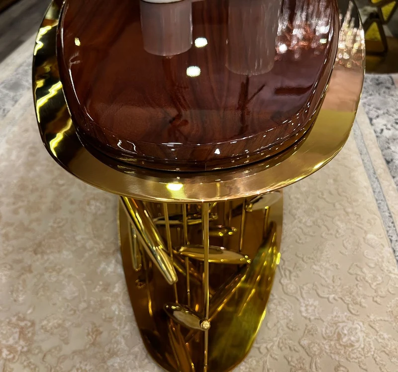 Casa Padrino Luxus Couchtisch Braun / Gold 120 x 51 x H. 47 cm - Ovaler Edelstahl Wohnzimmertisch mit Massivholz Tischplatte - Wohnzimmer Möbel - Hotel Möbel - Luxus Möbel