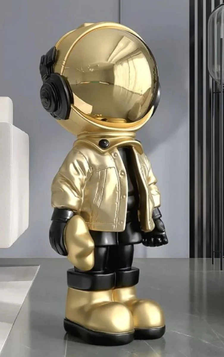 Casa Padrino Luxus Designer Deko Skulptur Astronaut Gold / Schwarz 30 x H. 70 cm - Kunstharz Deko Figur - Wohnzimmer Deko - Luxus Designer Deko Accessoires - Luxus Qualität