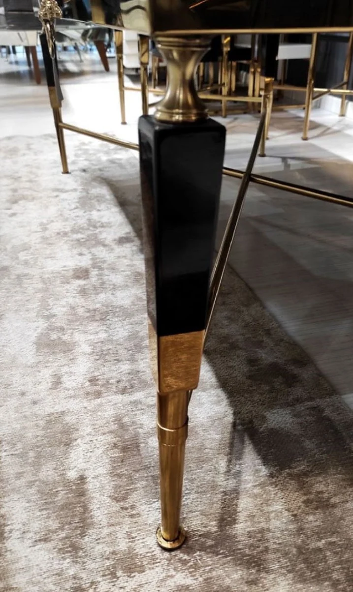 Casa Padrino Luxus Couchtisch Schwarz / Gold 130 x 70 x H. 45 cm - Wohnzimmertisch mit Kunstmarmor Tischplatte - Luxus Wohnzimmer Möbel - Hotel Möbel - Luxus Einrichtung - Hotel Einrichtung