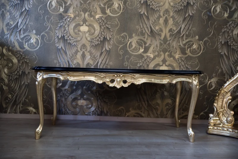 Casa Padrino Barock Couchtisch Pompöös by Harald Glööckler aus Buchenholz Schwarz / Gold 121 x 66 x 47 cm